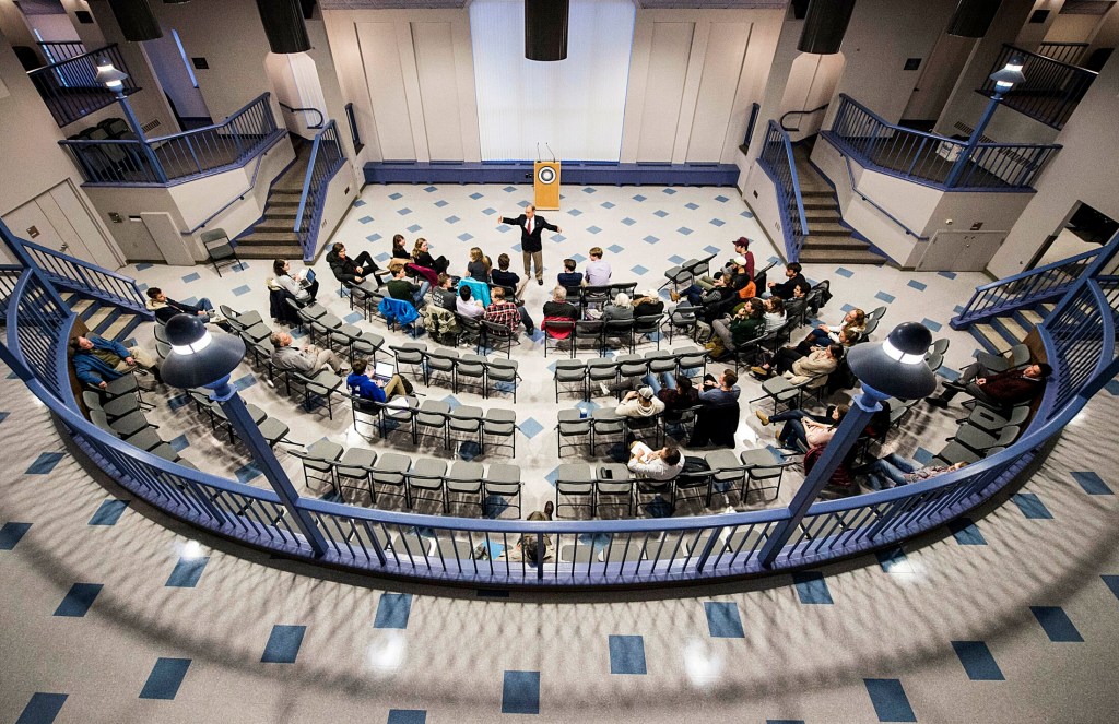 Former congressman Bruce Poliquin speaks to students during a public discussion on ranked-choice voting in the Page Commons Room at Cotter Union in Waterville on Tuesday.