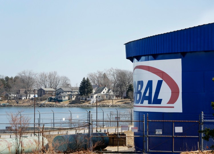 Homes along Ballard Street in South Portland, seen in April, are just across Barberry Creek from a Global Partners storage tank.