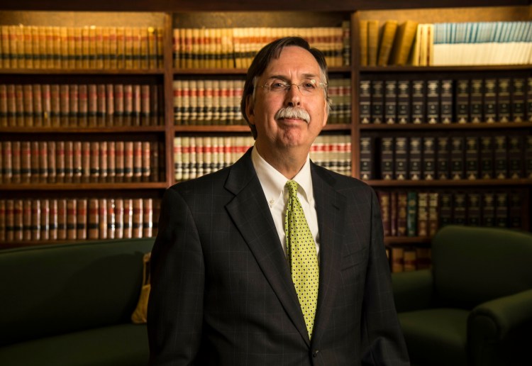 James LaLiberty poses for a portrait April 10 in the law library at the offices of Jabar LaLiberty and Dubard, LLC, in Waterville. LaLiberty is being recognized by the Mid Maine Chamber of Commerce for distinguished community service. 