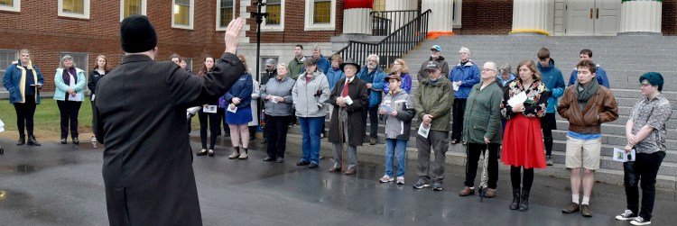 The Rev. Mark Wilson, of the Waterville UCC, delivers a prayer for attendees of the Community Ecumenical Easter Sunrise Service on Sunday at Colby College in Waterville.