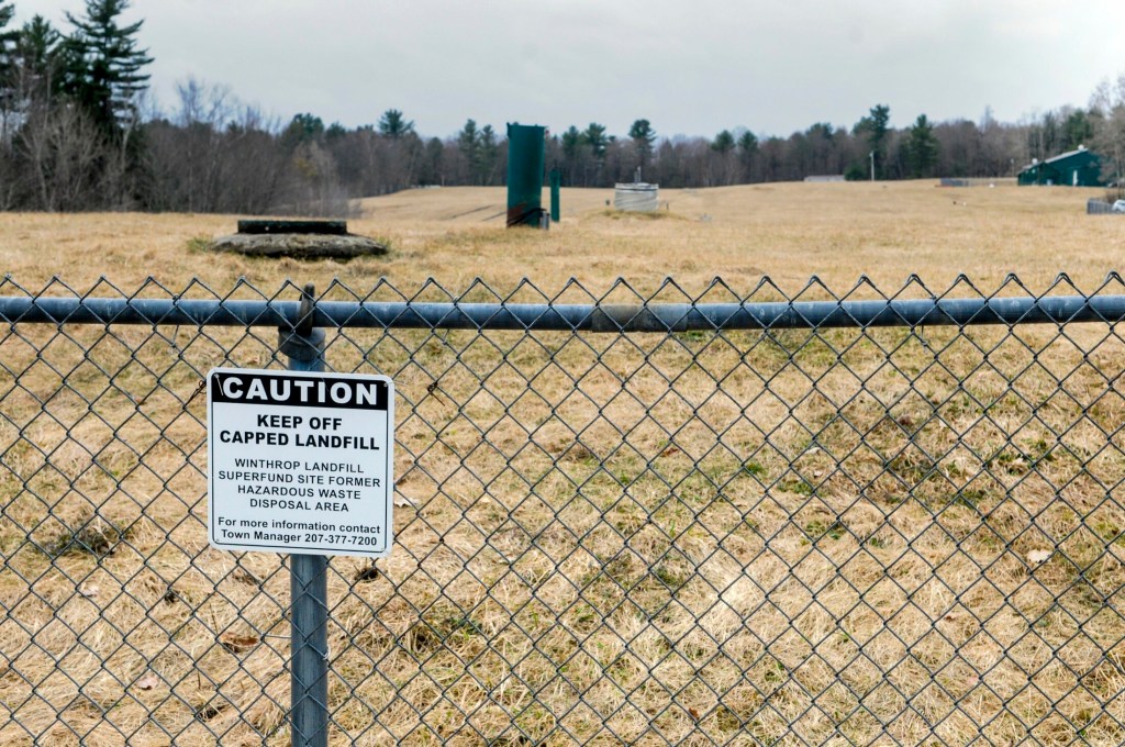 A chain-link fence blocks access to the Winthrop landfill Superfund site, shown Friday.