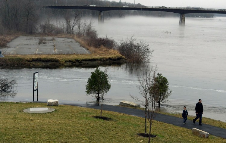 Water rises Sunday at the confluence of the Kennebec River and Cobbosseecontee Stream in Gardiner.