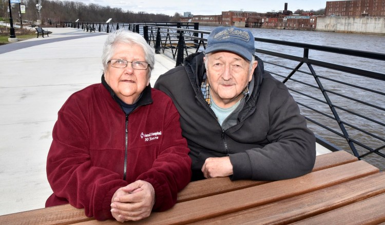 Vicky LaBrie and Clarence Spaulding enjoy an outing at the RiverWalk at Head of Falls in Waterville on April 28. 