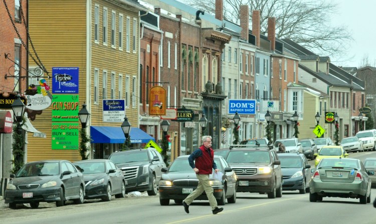 A man runs across Water Street on Jan. 30 in downtown Hallowell.