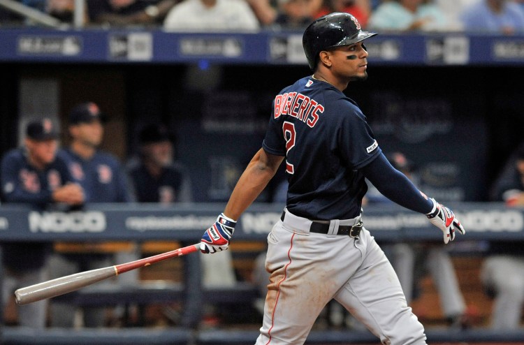 Xander Bogaerts hits a two-run double in the sixth inning for the Red Sox against Tampa Bay on Sunday in St. Petersburg, Florida.