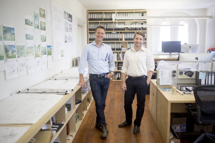 Matthew O'Malia, left, founder of GO Logic, and Joshua Henry, a partner in GO Lab, pose for a portrait in their Belfast office building in 2017. GO Logic is a high-performance home builder working to develop a wood-based insulation board. It launched GO Lab to spearhead research and development. 