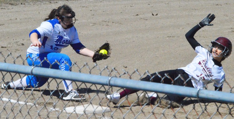 MCI baserunner Jillian Frost (10) slides safely into third base ahead of the tag from Morse's Abigail Carpenter on Wednesday at Legion Field in Bath. 