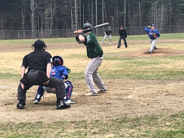 Oak Hill pitcher Caleb Valliere fires a pitch to Spruce Mountain's Noah Gilbert during a game Monday in Wales.