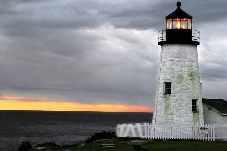 The sun sets behind Pemaquid Point Lighthouse in 2005. The winter sun goes down earlier in the day in eastern Maine towns than anywhere else in the continental United States. 