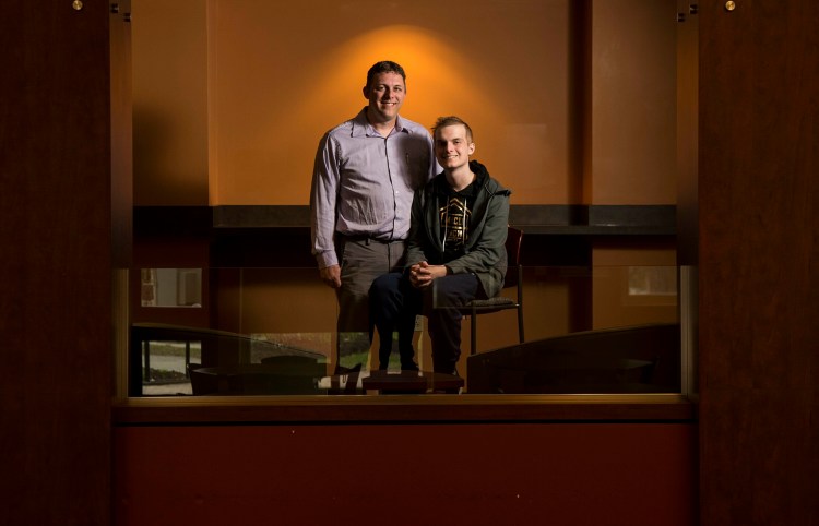 Joe Seigars, left, and his son, Jacob Seigars, pose for a portrait Thursday at Kennebec Valley Community College. After suffering a stroke in 2011, Joe Seigars decided to go back to school to become a radiology technician. He will graduate Saturday, having earned his degree while also having to work through his son’s battle with leukemia.