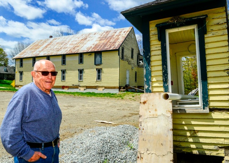Al Godfrey, Friends of Starling Hall executive board member, talks Wednesday about how volunteers used chain saws to cut the entryway, far right, off of Starling Hall in 2017, before the main building was moved farther back from Route 17 in North Fayette. Renovation plans for the structure call for building a similar entryway.