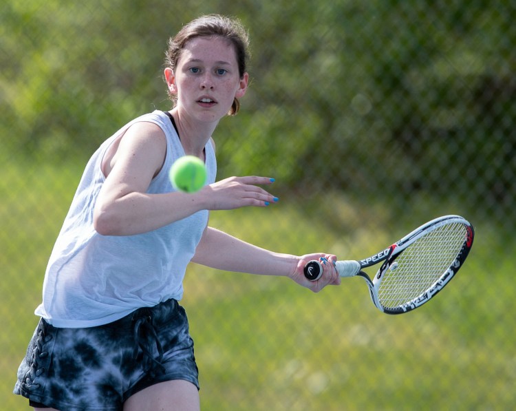 Grace Campanella, of Kennebunk-Wells lines up a shot during her match against York's Daphne Stratton-Gignac  during Saturday's MPA Singles Championships at Lewiston High School.