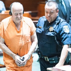 Albert Flick is led out of the courtroom following his initial appearance in the Androscoggin County Courthouse in Auburn last month (Russ Dillingham/Sun Journal)