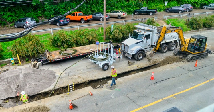 Workers dig a trench Thursday to lower an existing natural gas pipeline under Commercial Street in downtown Augusta. It is the start of construction projects that will soon see two-way traffic on Water Street.