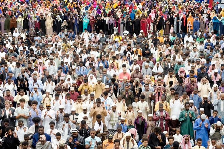 Muslims prayed during Eid at the Androscoggin Bank Colisee in Lewiston in 2019, filling the space to observe the religious holiday that marks the end of Ramadan. This year, the month-long holiday starts on Thursday, but unless restrictions on gathering are lifted, Maine's Muslim community will celebrate at home. 