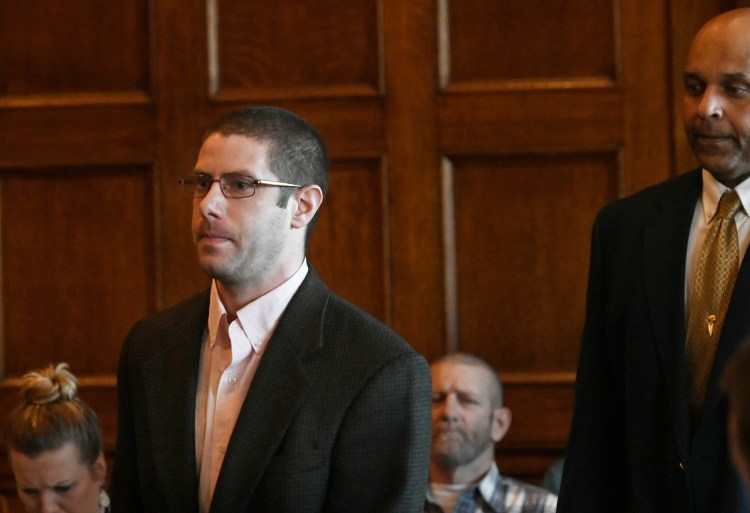 John Williams, who is charged with murder in the slaying of Somerset County Sheriff's Department Cpl. Eugene Cole, enters the Cumberland County Courthouse in Portland for opening arguments Monday.