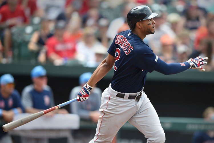 Xander Bogaerts follows through on a RBI double in the fourth inning of Boston 8-6 win over the Baltimore Orioles on Saturday in Baltimore.