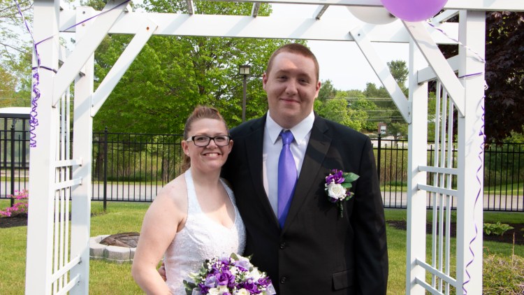 Tiffany Fletcher and Tresden Bergeron pose for photos before they were announced to waiting friends, family and residents.