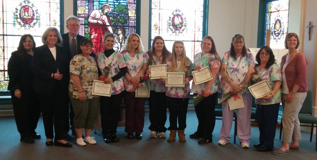 From left are Athena Briggs, WMCA Employment & Training Specialist; Monica Millhime, WMCA Regional Employer Assistant Point; Bill Laney, RSU 54 Community & Adult Education Director; Stephanie Aucoin, Mt. St. Joseph Assistant Director of Clinical Services; CNA graduates Bernadette DiOrio, Paula Bratton, Melanie Sally, Amanda James, Michelle Moody, Vicki French and Dawn Moreshead; and Diane Sinclair, MSJ Administrator. 