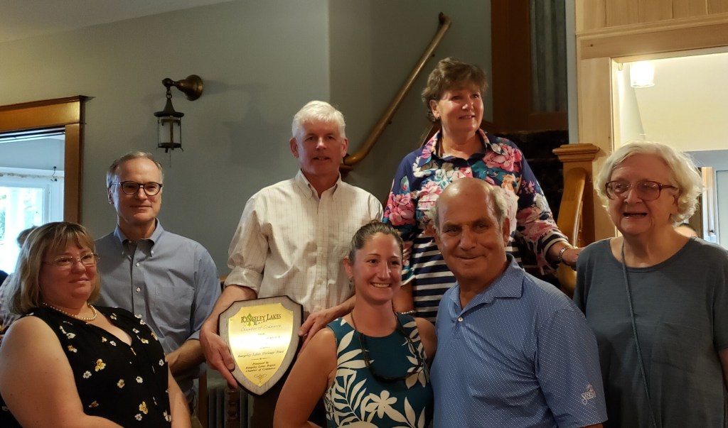 Rangeley Lakes Chamber of Commerce presented its annual Community Service Award to the Rangeley Lakes Heritage Trust. Front from left are Tracie Clinch, Amanda Laliberte and Ed Kfoury, of the trust; and Joanne Dunlap, chamber. Back from left are Bob Landis and David Miller, both with the trust; and Margie Jamison, chamber. 