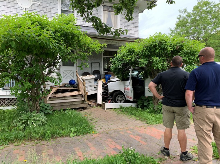 A van struck the porch of a building in Portland Tuesday morning. 