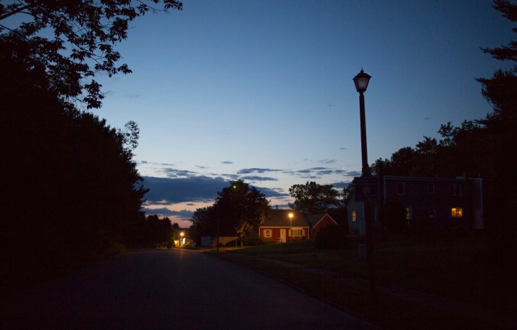 A broken streetlight on Palmer Avenue leaves a Portland neighborhood in the dark. On Wednesday, the city and CMP agreed to fix broken lights served by underground connections while regulators consider broader contract issues.