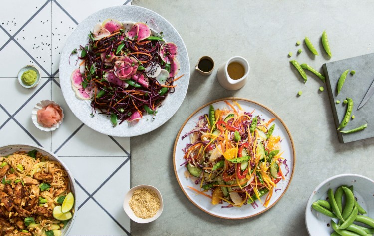 The Peanut & Sticky Chili Chicken Rice Noodles salad is pictured on the far left. 