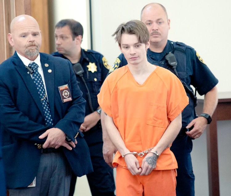 Gage Dalphonse of Auburn is led into Androscoggin County Superior Court in Auburn by deputies in August.