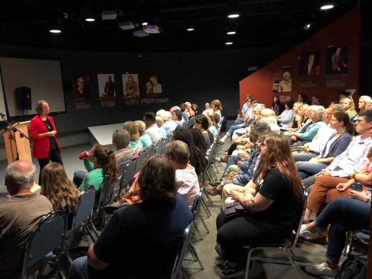 Holocaust and Human Rights Center of Maine executive director Shenna addresses the crowd Wednesday prior to a talk, “It’s not over: Slavery Then, Racism Now," by Shay Stewart-Bouley, executive director of Community Change Inc. and author of the blog, “Black Girl in Maine.”