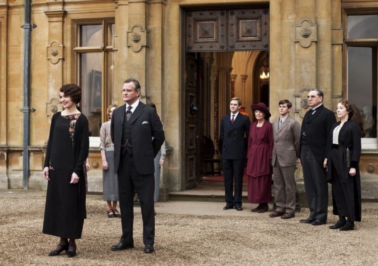 This undated publicity photo provided by PBS shows, from left, Elizabeth McGovern as Lady Grantham, Hugh Bonneville as Lord Grantham, Dan Stevens as Matthew Crawley, Penelope Wilton as Isobel Crawley, Allen Leech as Tom Branson, Jim Carter as Mr. Carson, and Phyllis Logan as Mrs. Hughes, from the TV series, "Downton Abbey." 