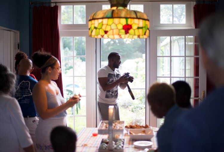 Luc Mpangaje at a gathering in Cape Elizabeth over the Labor Day weekend. He came to Portland in 2010 from his native Burundi with no money and found a community that was willing to help him get housing and asylum. He is now an American citizen living in Texas with his wife and two children.