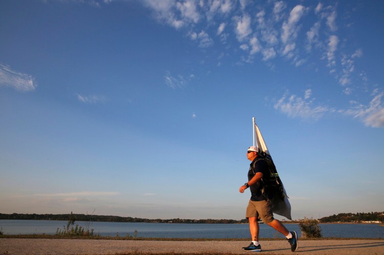 Greg Johnson, executive director of the Summit Project, walks Portland's Back Cove Trail on Sept. 20 as part of a 20-mile hike in preparation for his 150-mile trek between Cadillac Mountain and Mount Katahdin.