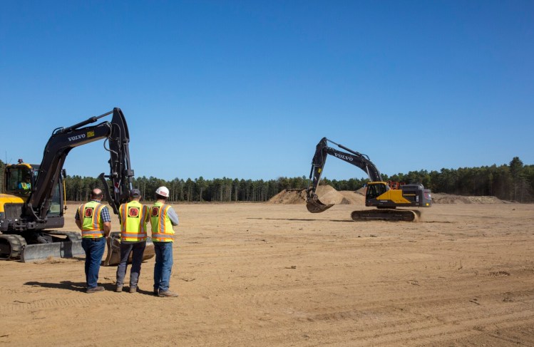 Crews set up their construction machinery on Wednesday for Friday's groundbreaking ceremony at the recently cleared site of the Innovation District at The Downs in Scarborough.