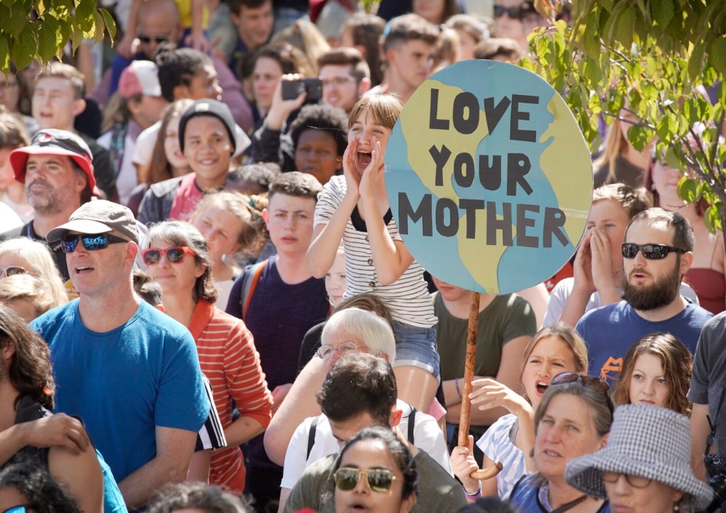 Over 2,000 people filled City Hall Plaza to hear speakers and call for action to combat climate change.