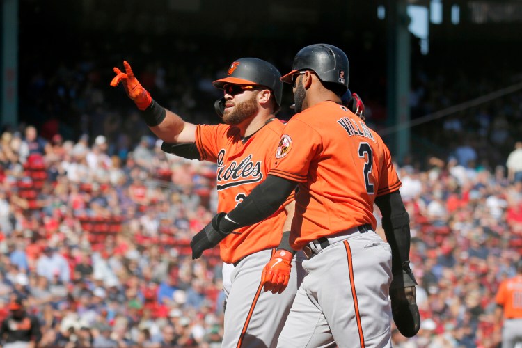 Baltimores DJ Stewart celebrates with  Jonathan Villar after hitting a two-run home run scoring Villar Saturday against the Boston Red Sox.  