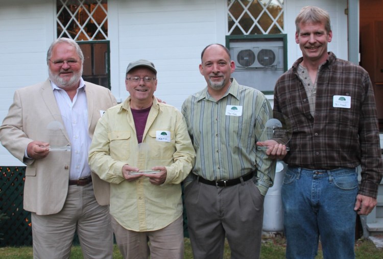 Winthrop Lakes Region Chamber recognized three local businesses for their commitment to community and excellence. From left are David Struck, of D. R. Struck Landscape Nursery, who with Robin Struck, not pictured, received the Entrepreneurship Award; Keith Peters, publisher of the Community Advertiser, received the Community Service Award; and Knowles Lumber Co. owners Paul King and Bill Abbott received the Dynasty Award for their 69-year-old business.