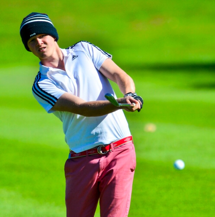 Kents Hill senior Mitchell Tarrio watches his shot at the team state championships earlier this season at Natanis Golf Club in Vassalboro. 
