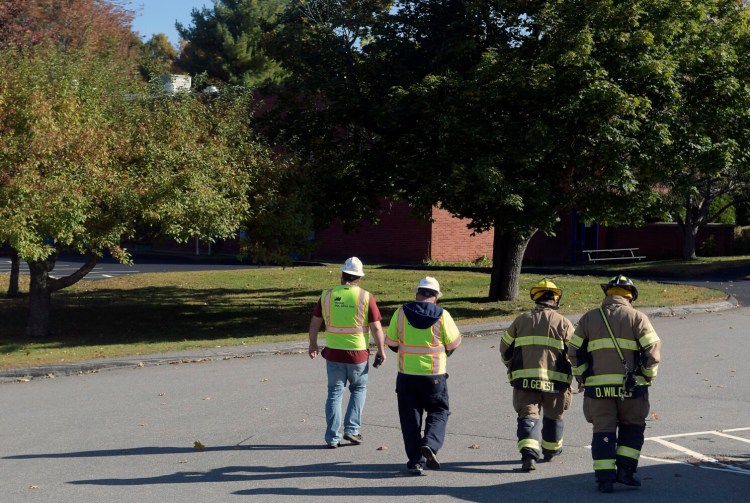 Augusta firefighters accompany gas technicians Thursday to check for a leak at the Maine State Police Crime Laboratory in Augusta.