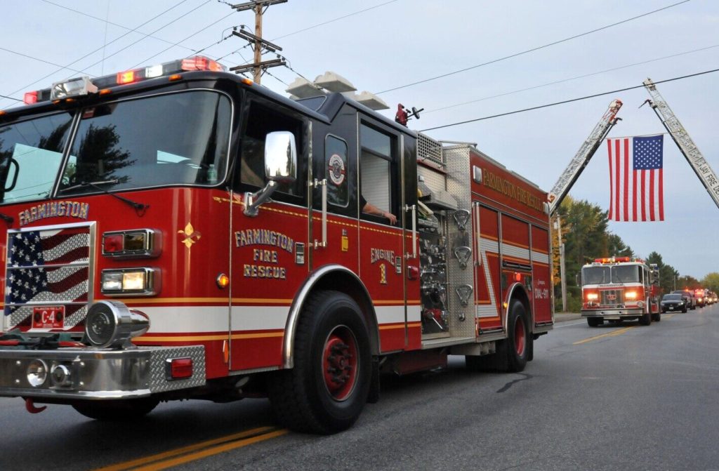 A procession Tuesday transports Farmington Fire Rescue Chief Terry Bell into Farmington. Bell was released from Maine Medical Center Tuesday. Multiple agencies participated in the procession.