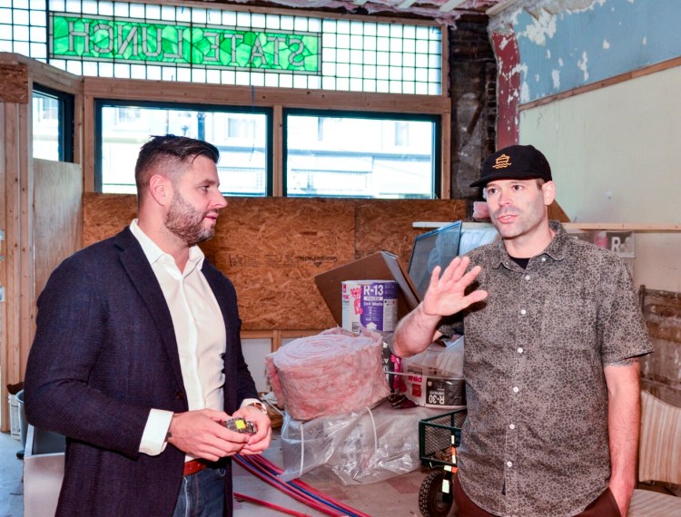 Shawn McLaughlin, left, and Tobias Parkhurst answer questions Wednesday inside State Lunch Craft and Kitchen on Water Street in downtown Augusta.