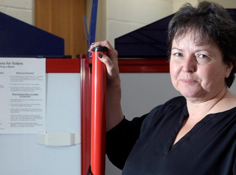 New Augusta City Clerk Barbara Geaghan at a polling station Tuesday at City Center in Augusta.