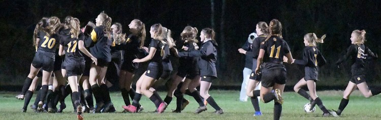 Maranacook players celebrate their Class C South quarterfinal victory over Waynflete on Tuesday in Readfield.