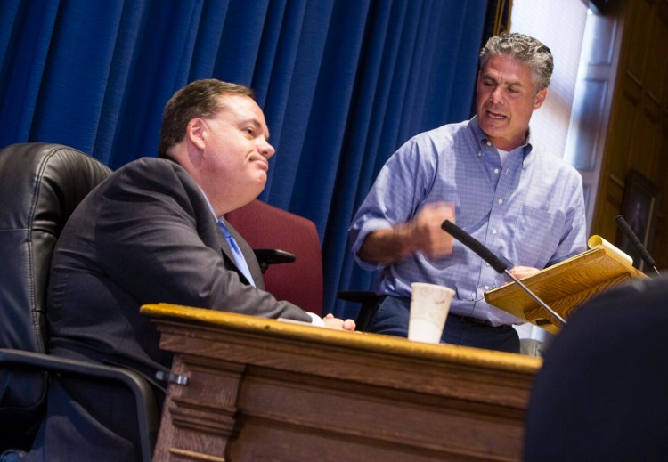 Portland City Manager Jon Jennings looks away from Mayor Ethan Strimling as he speaks during a contentious workshop in 2017 on the role of an elected mayor. Jennings says he might re-evaluate his future with the city if Strimling is re-elected. Carl D. Walsh/Staff Photographer