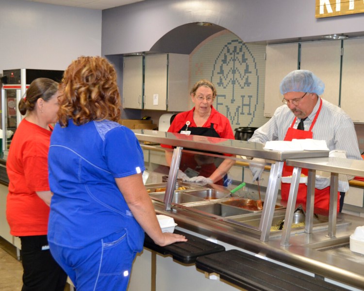 A spaghetti fundraising luncheon took place Oct. 16 at the Franklin Memorial Hospital cafeteria in Farmington that raised $2,051 to benefit those who were affected by the Farmington explosion via the LEAP Explosion Fund at United Way of the Tri-Valley Area. Serving from left are Carolyn Hammond, cook' and Bert Dugal, senior director support services.