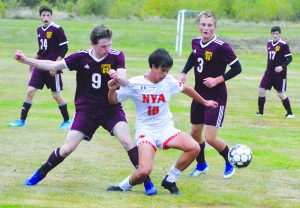 North Yarmouth Academy's Stefan Kulhanek handles the ball in traffic during last week's 1-0 win at Richmond.