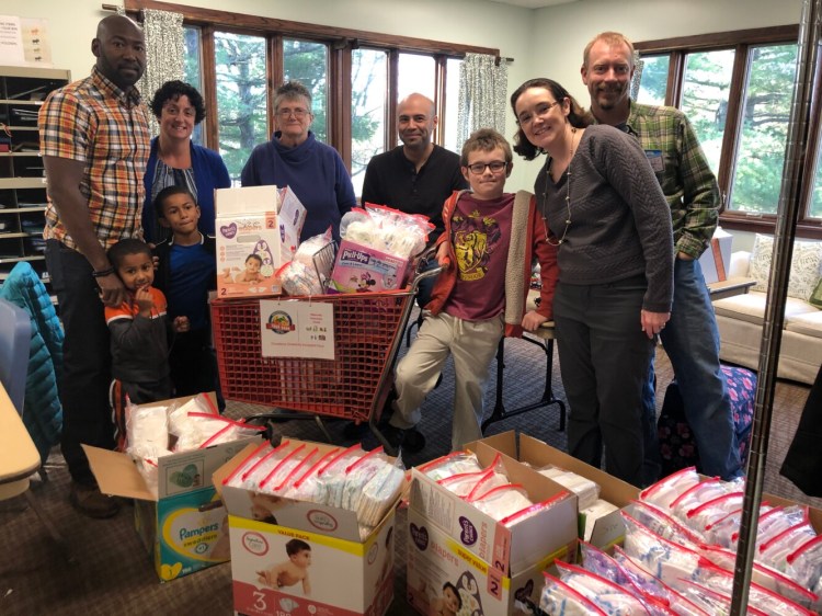 Diaper drive helpers from left are Dwayne and Aimee Campbell, with their sons Eli and Malcolm, in front; and Dawn Cates, Robert Hernandez, Caleb Knock, Melinda Corey and Jonathan Knock.
