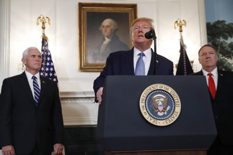President Trump, accompanied by Vice President Mike Pence, left, and Secretary of State Mike Pompeo, said Wednesday that Turkey told him it is observing a "permanent cease-fire" in Syria. 