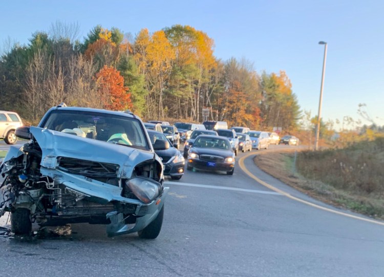A car's front end is smashed following a crash Thursday morning on the Exit 112 off-ramp for Interstate 95 and Civic Center Drive. 