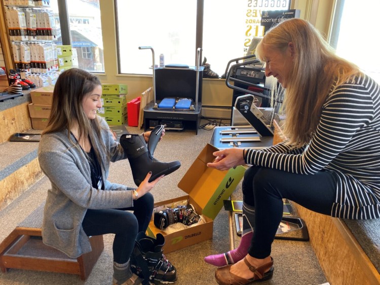 Gayle Labrecque, right, gets fitted for new boots by Anna Drumster, certified boot fitter at Downhill Supply Co. at Sugarloaf Mountain. 