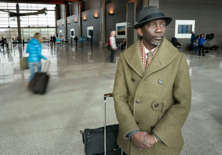 Pious Ali poses for a photo in the Portland International Jetport on Thursday before catching a flight to Washington, D.C. Ali and fellow Portland Councilor Brian Batson are proposing that Portland ban the use of facial scanning technology by city employees, including the police department. If successful, Portland would be the first community in the state, and one of a few in the country, to ban the technology. 